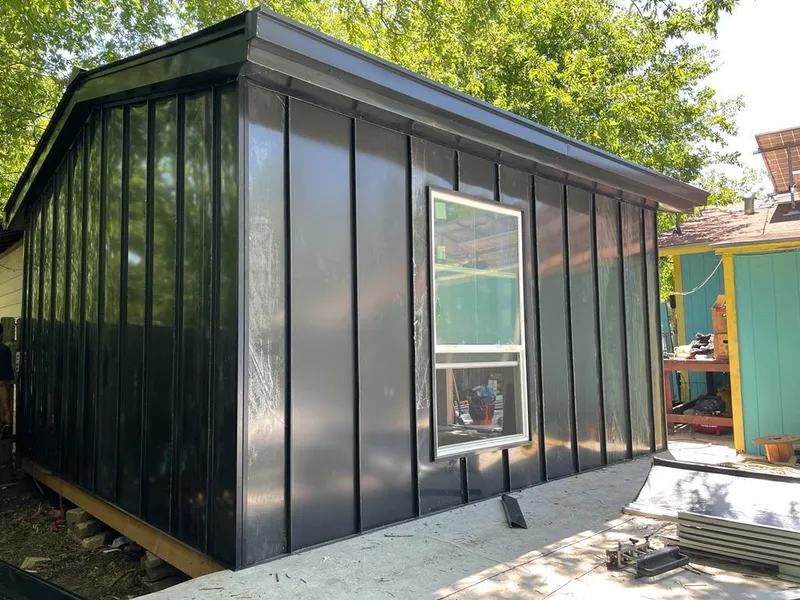 Black standing seam metal wall panels for Metal Roof Installation in West Park